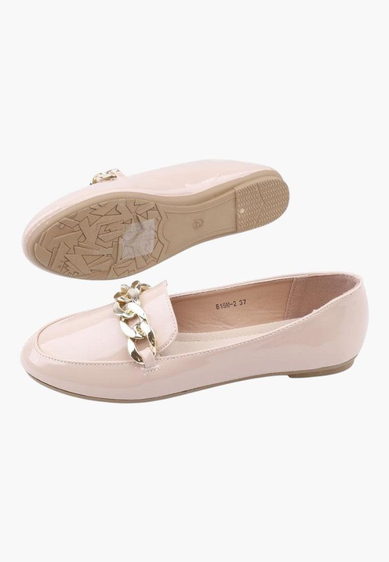Other view of pink flat shoes with decorative buckle and flat sole.
