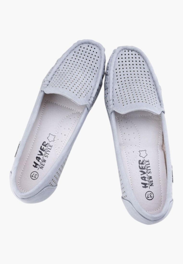 Close-up detail of gray women's moccasins showing soft material and comfortable insole.