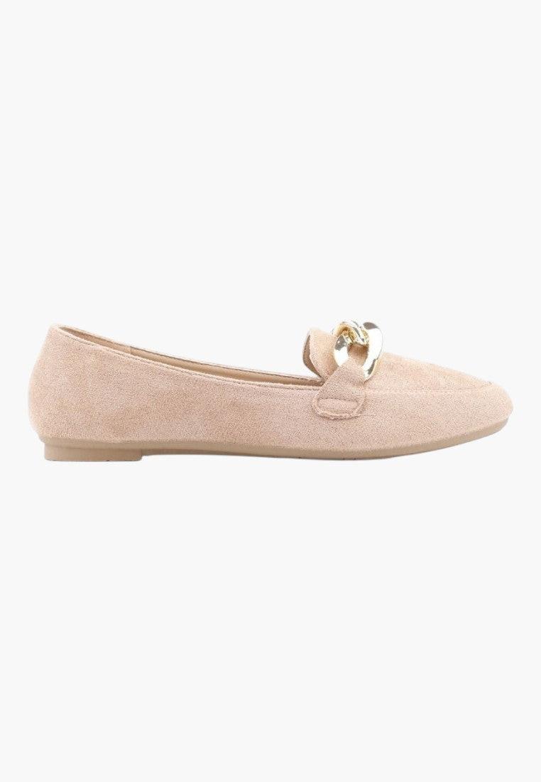 Side view of beige suede loafers showcasing a slim profile