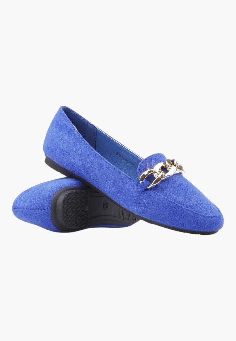 Packaging of blue suede flat shoes with a decorative buckle.