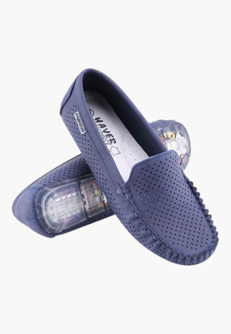 Lifestyle view of navy loafers in a casual setting, showcasing comfortable fit