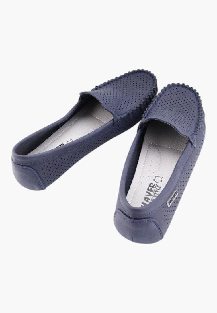 Side view of navy loafers featuring a slip-on design
