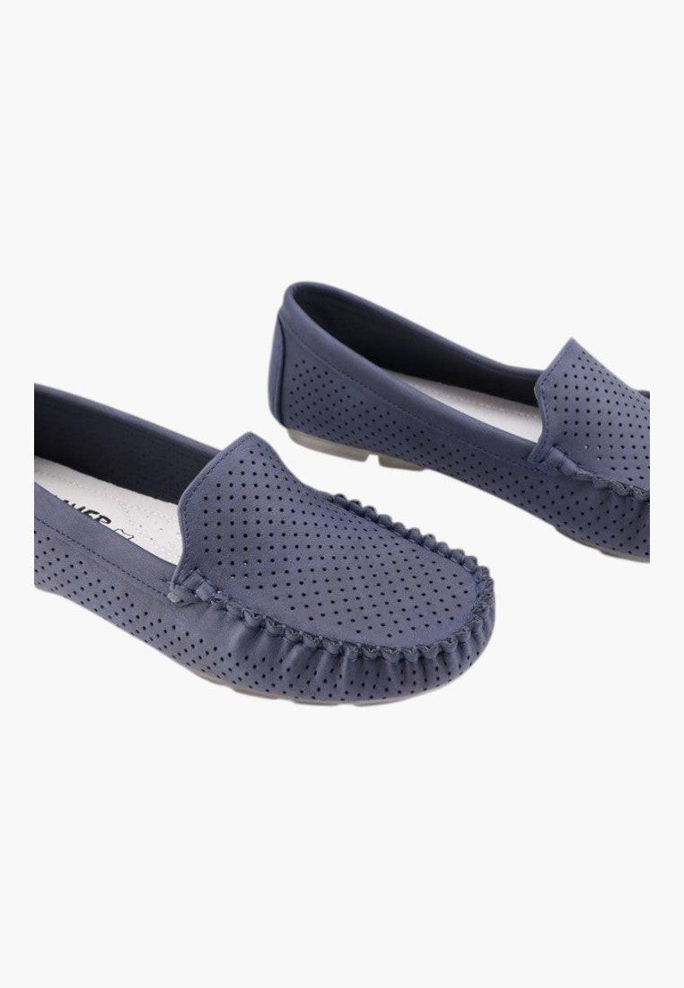 Side view of navy loafers with a rounded toe and flexible sole