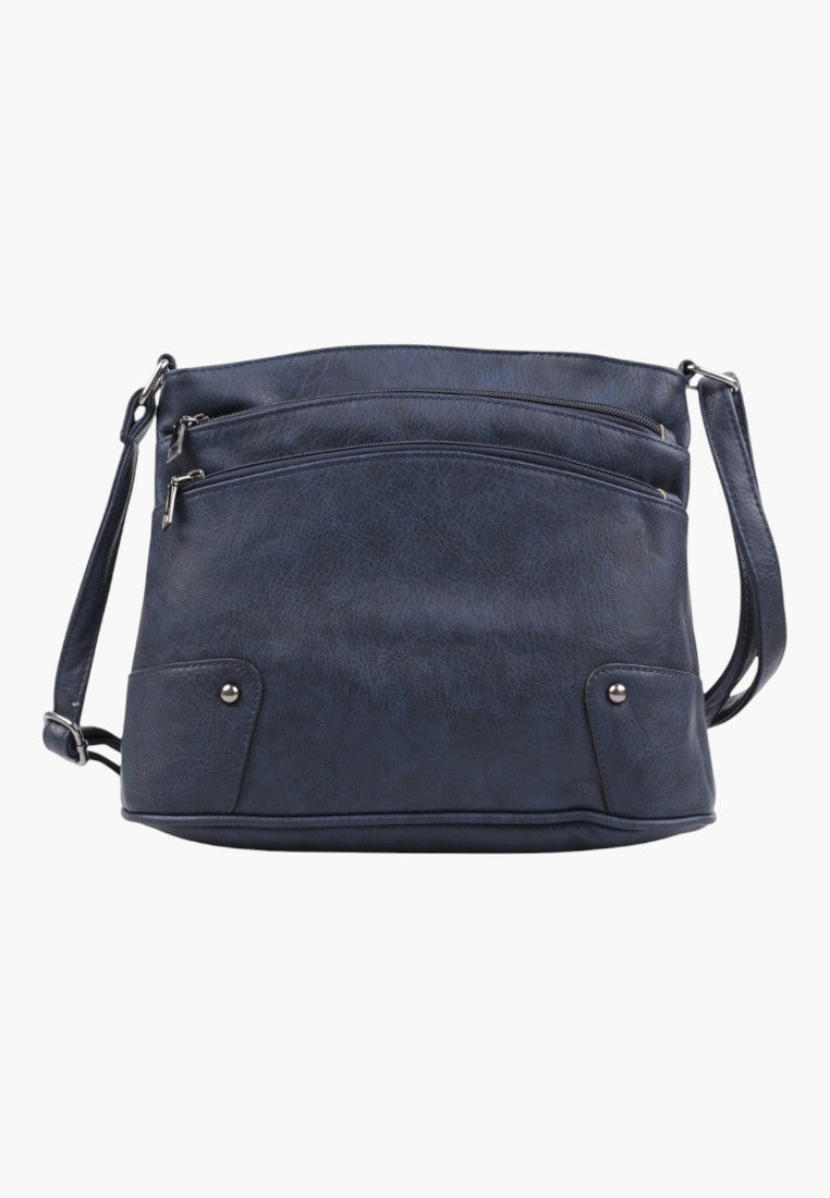 Tylny widok granatowej torebki crossbody z gładką teksturą i regulowanym paskiem.
