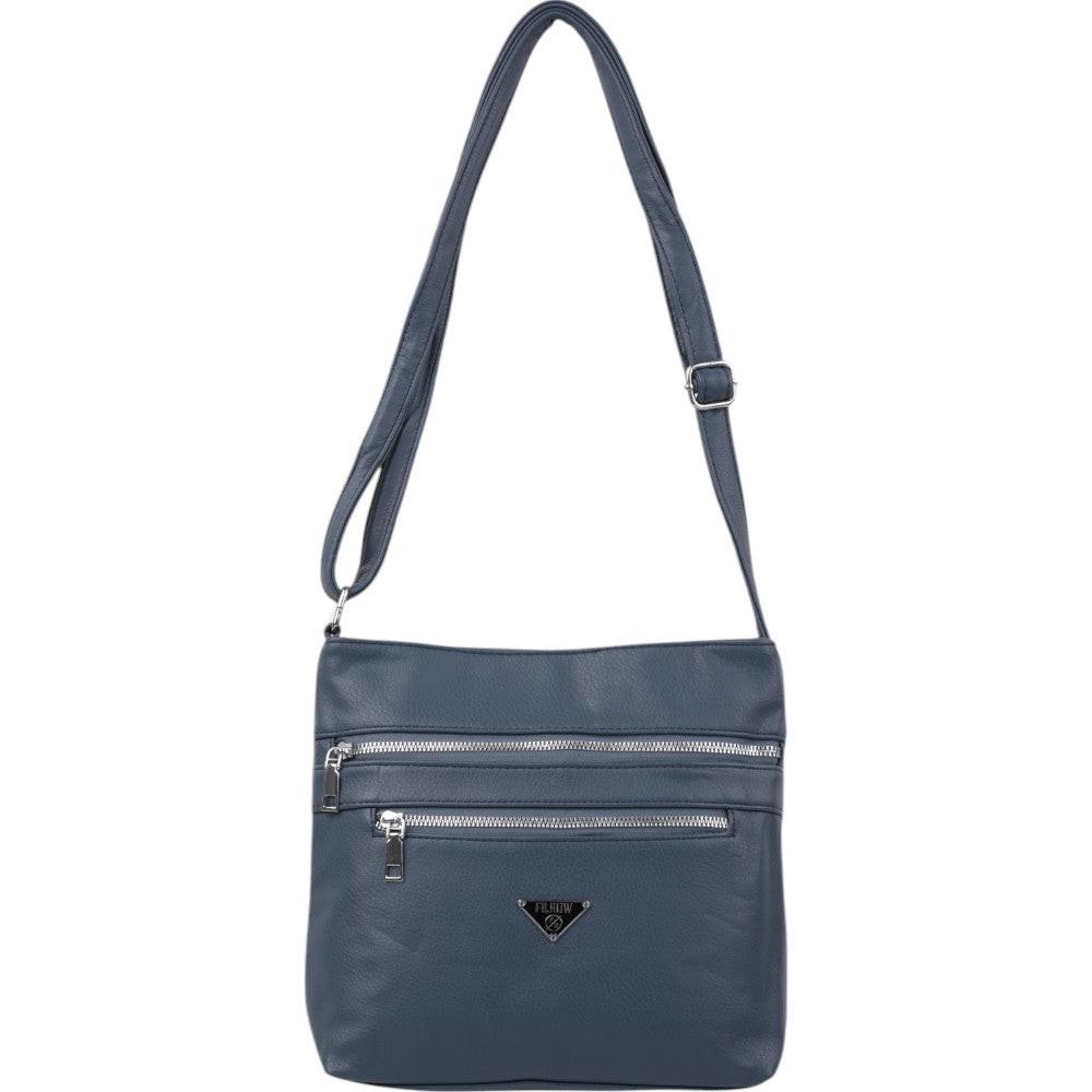 Back view of a navy crossbody bag with two front pockets and a gold logo on a white background.