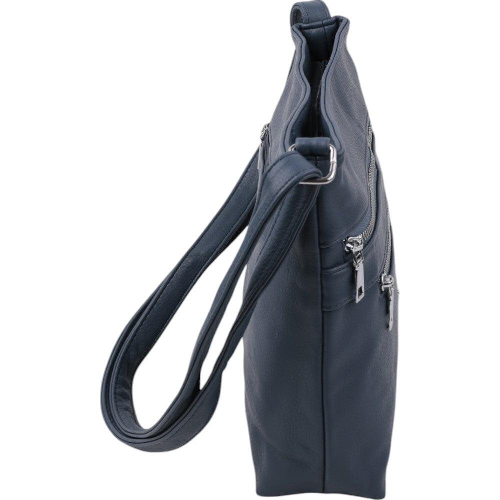 Side view of a navy crossbody bag showcasing its slim profile and zipper closure on a white background.
