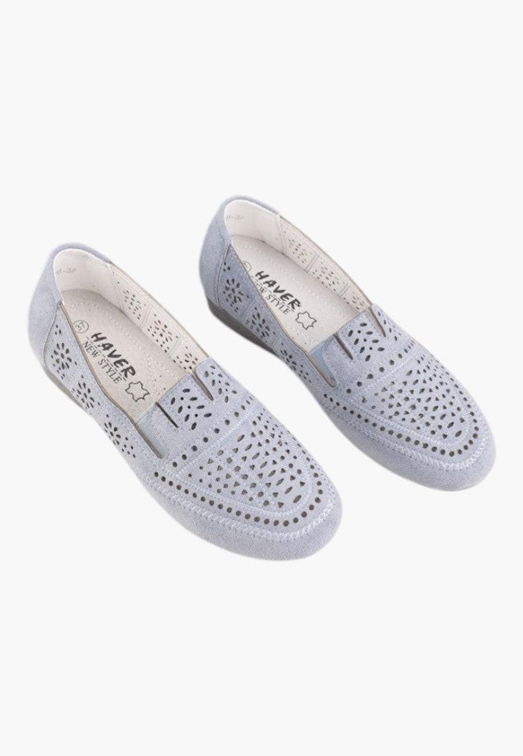 Detail close-up of blue perforated moccasins with elastic sides.