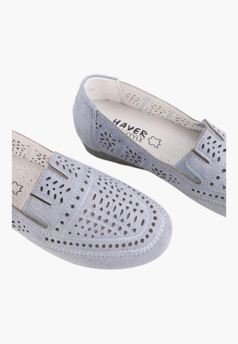 Side view of blue moccasins showcasing a sleek design.
