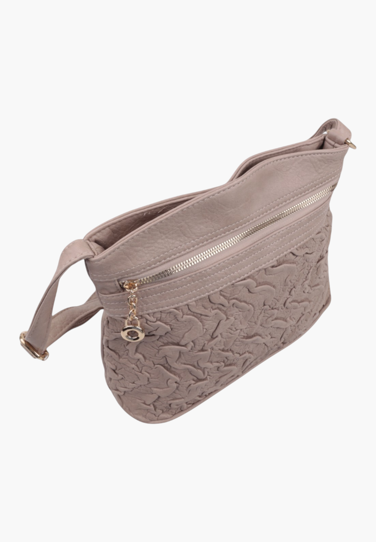 Side view of a beige crossbody bag highlighting a zipper pocket.