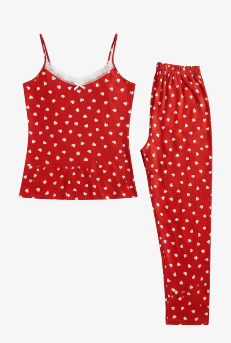 Front view of red pajama set with white heart print, including camisole top with lace trim and matching long pants.