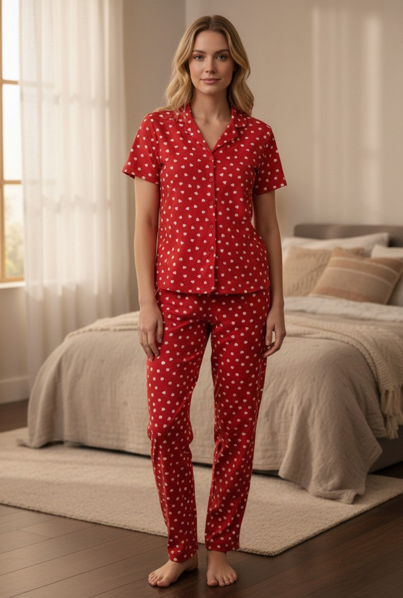 Front view of a red heart print pajama set with short sleeves and button-down shirt.