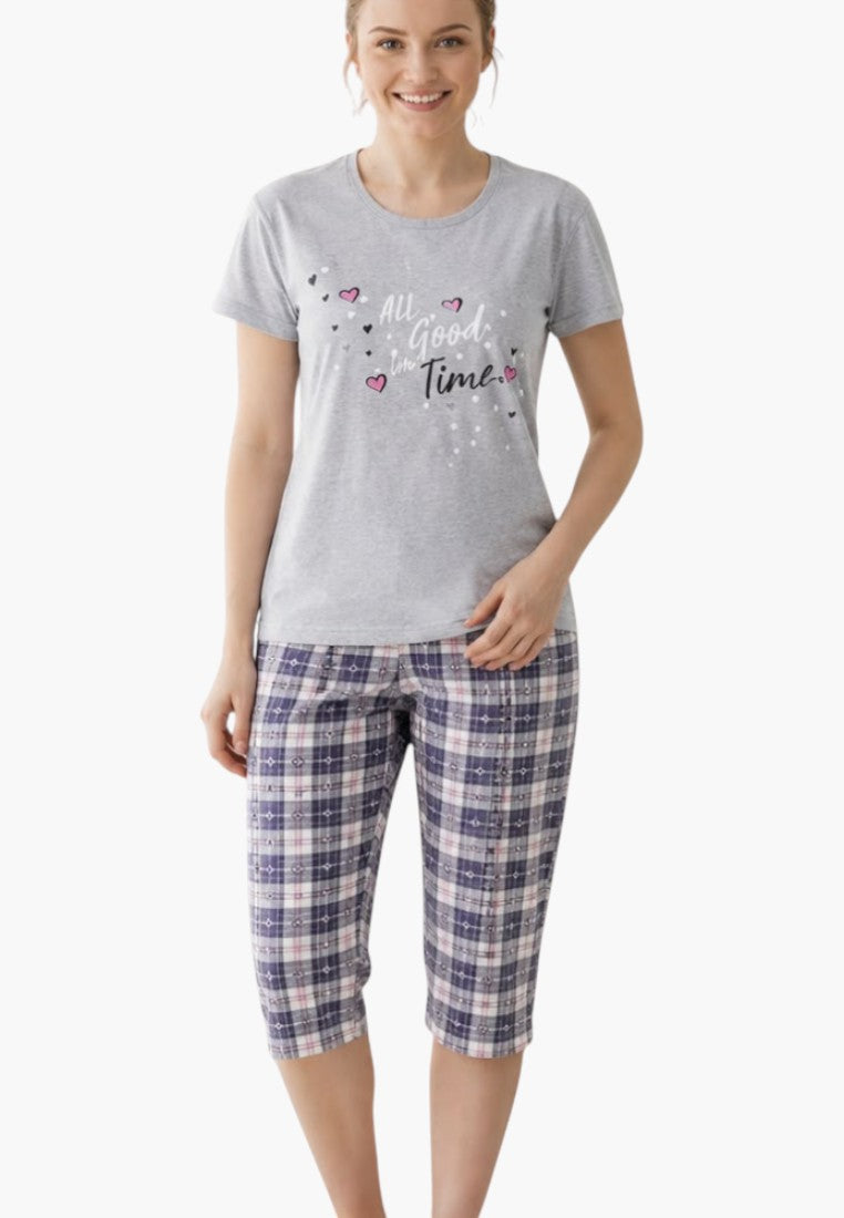 Front view of women's pajama set in gray, blue, and white with plaid pants.