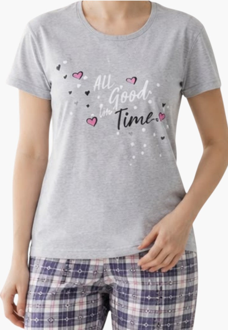 Detail close-up of women's pajama top in gray and red with graphic design.