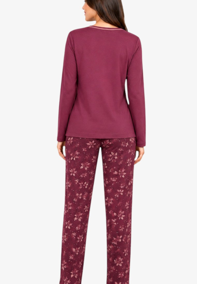 Back view of burgundy cotton pajamas featuring long-sleeved top and floral print trousers.
