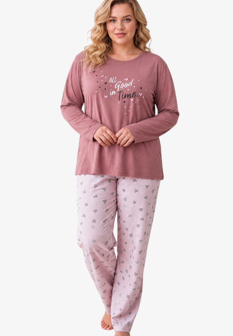 Front view of plus size cotton pajama set with long sleeves and heart-patterned trousers in pink tones.