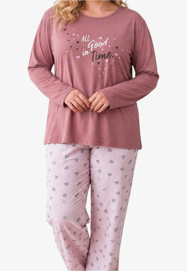 Front view of plus size women's cotton pajama set with long sleeves and heart-patterned trousers in pink and grey.