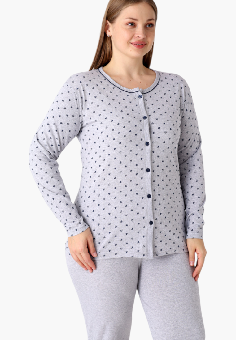 Side view of plus size cotton pyjama set with long sleeves and button-down top featuring grey heart print.