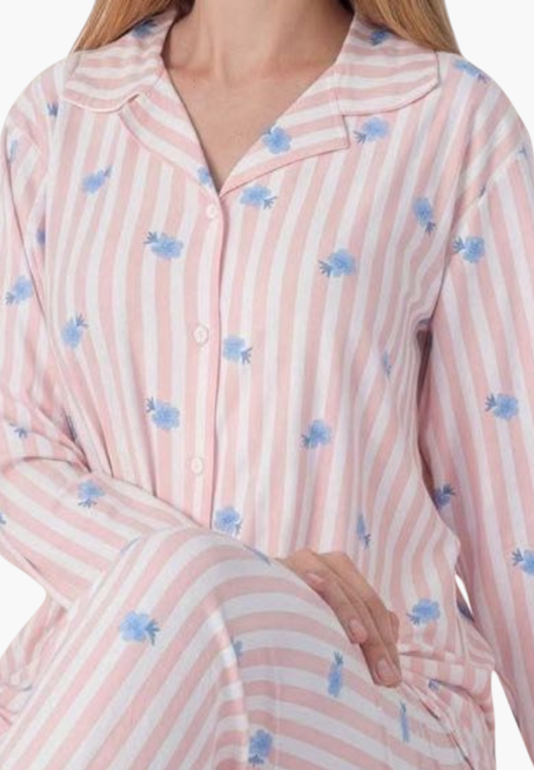 Detail close-up of a striped pajama set in pink, blue, and white with a button-up collar.