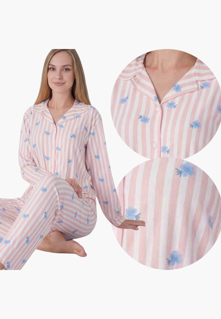 Lifestyle shot of a striped pajama set in pink, blue, and white with floral print.