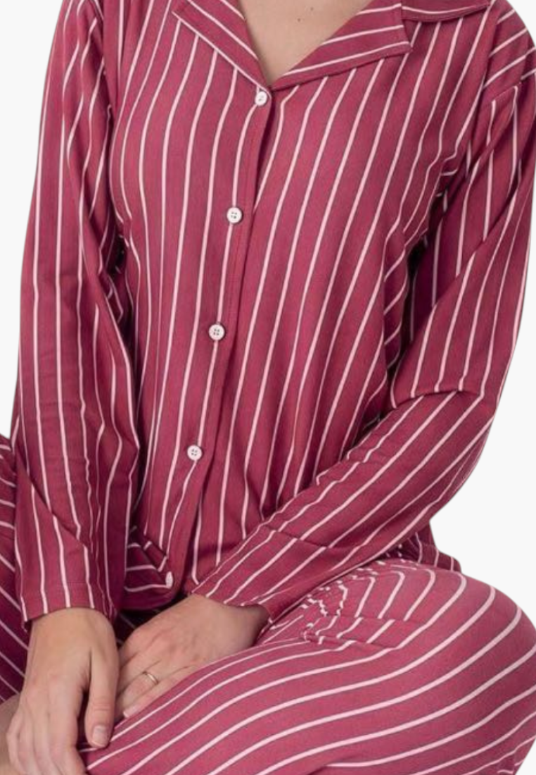 Detail close-up of a red and white striped pajama set highlighting the button closure.
