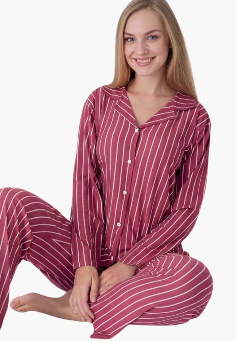 Lifestyle view of a red and white striped pajama set featuring long sleeves.