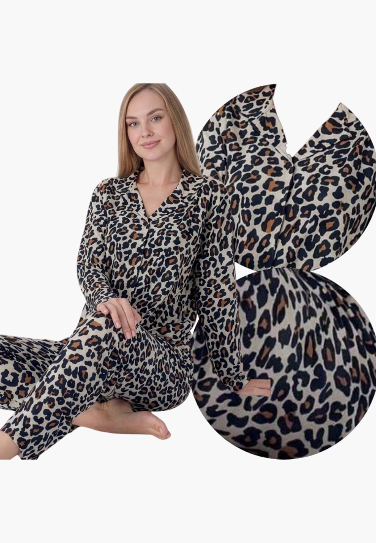 Lifestyle shot of leopard print pajamas in black, beige, and orange with long sleeves.