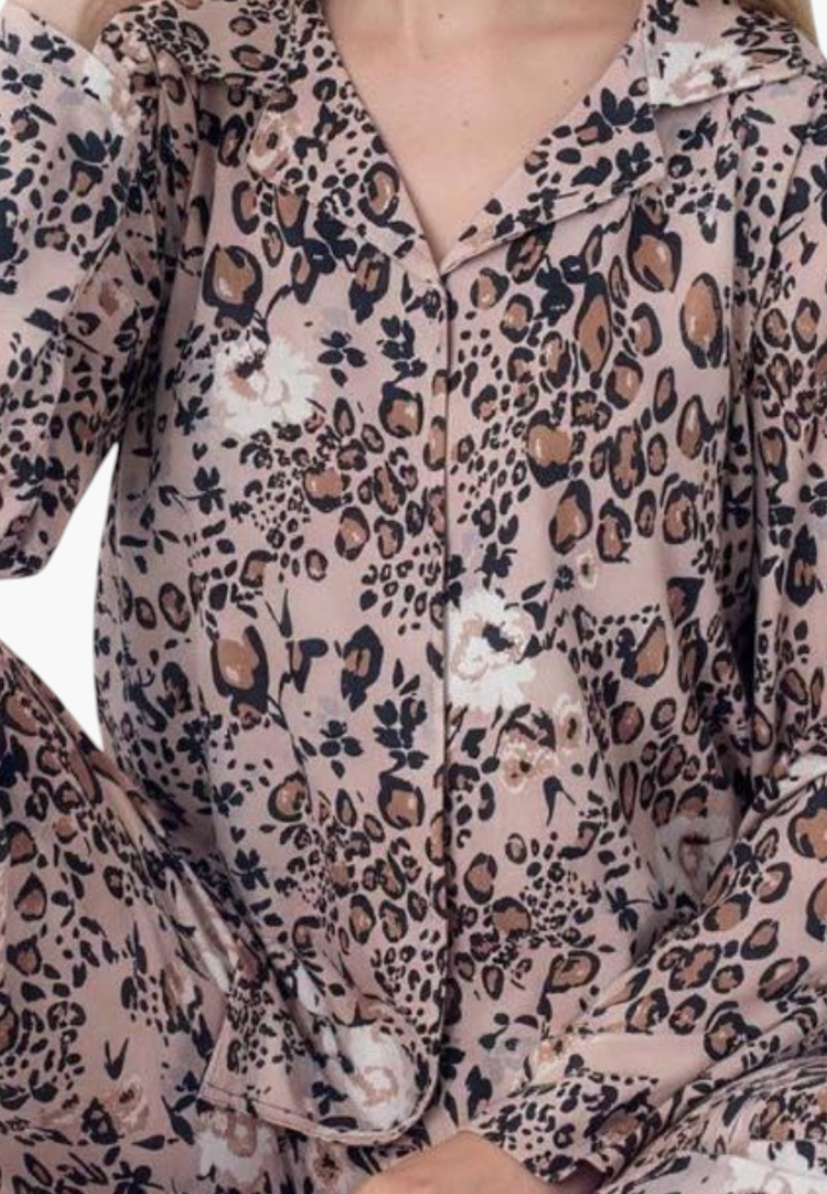 Detail view of a floral pajama set showcasing the button closure and floral pattern.