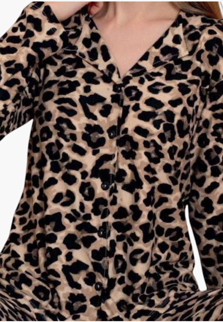 Detail close-up of soft leopard print pajamas in beige and black.