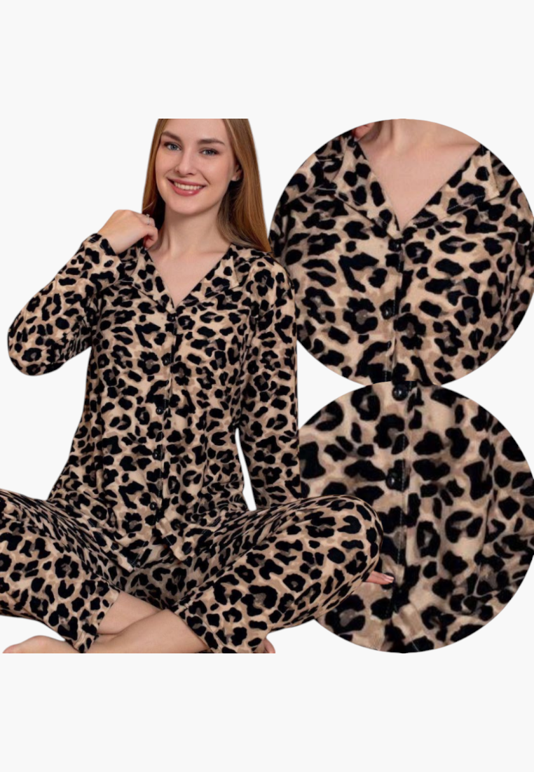 Lifestyle shot of leopard print pajamas in beige and black with long sleeves.