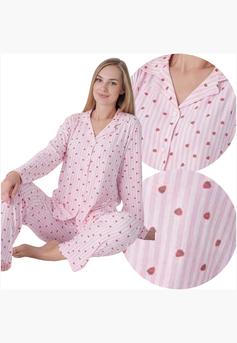 Lifestyle shot of a pink pajama set with polka dots and button closure.