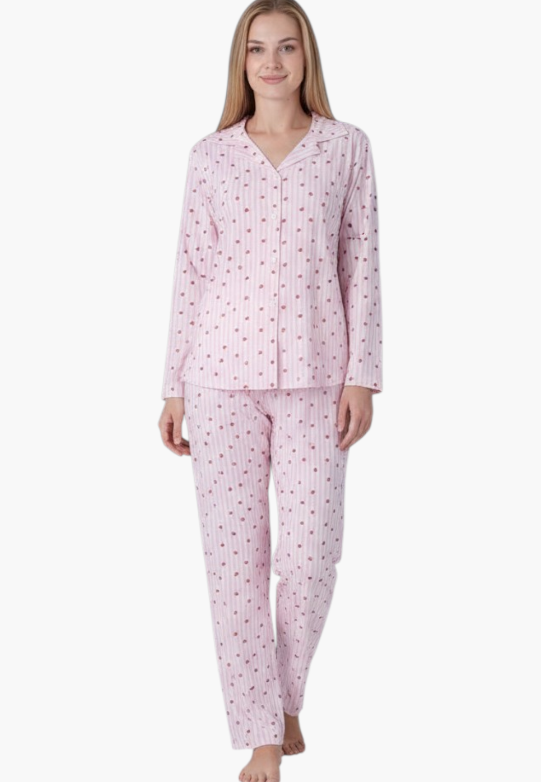 Lifestyle shot of a pink pajama set with polka dots on a white background.