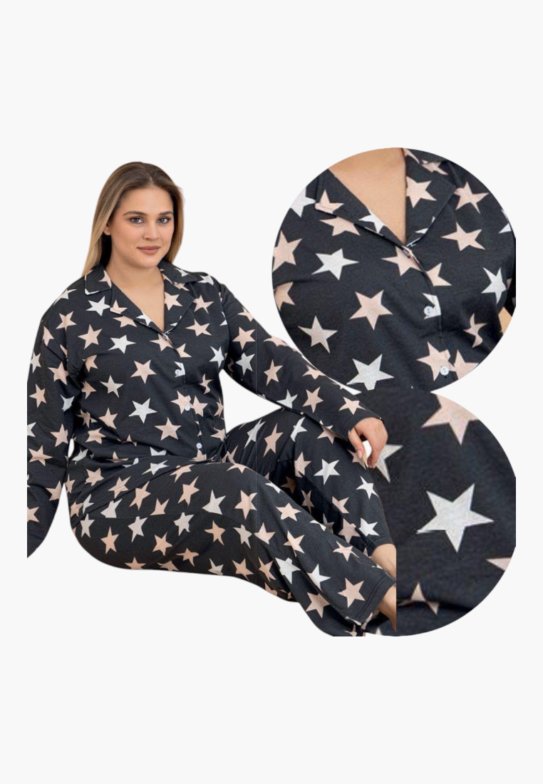 Lifestyle shot of navy, pink, and white star-patterned pajamas with long sleeves and button-up top.
