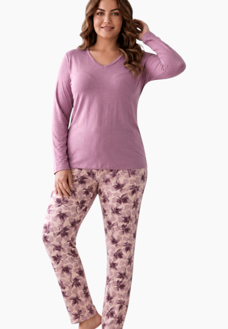 Lifestyle shot of the purple pajama set featuring floral print pants.