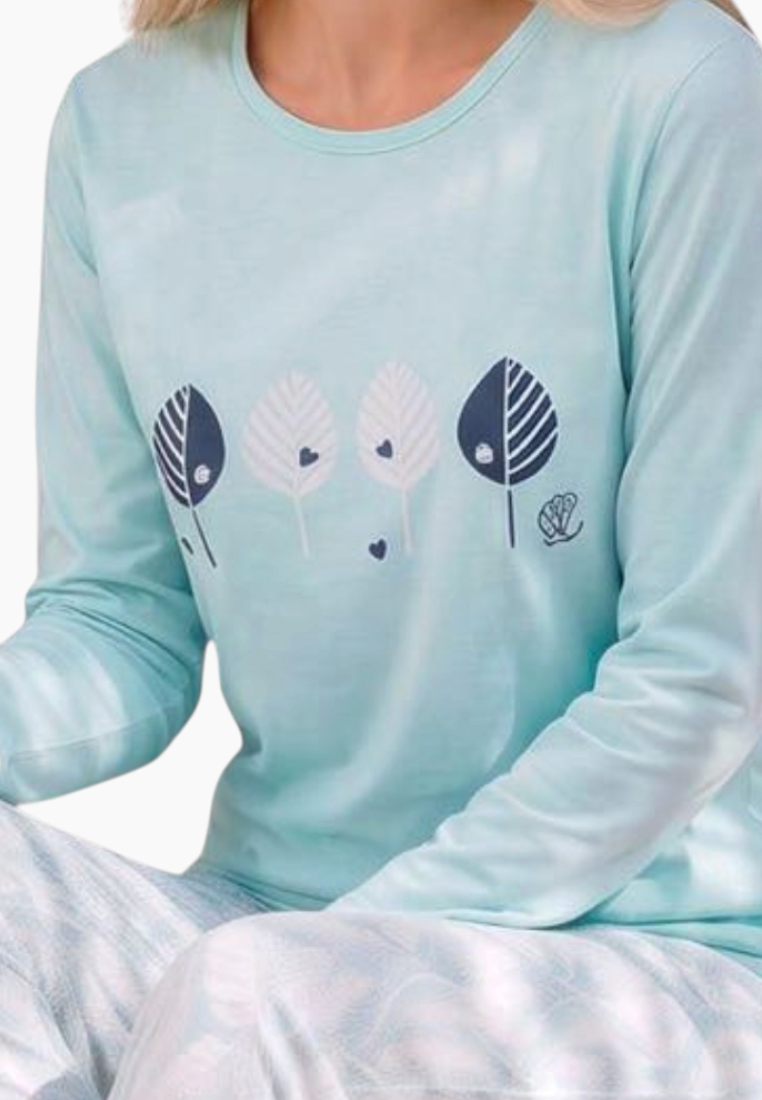 Close-up detail of light blue pajama top featuring graphic print and long sleeves.