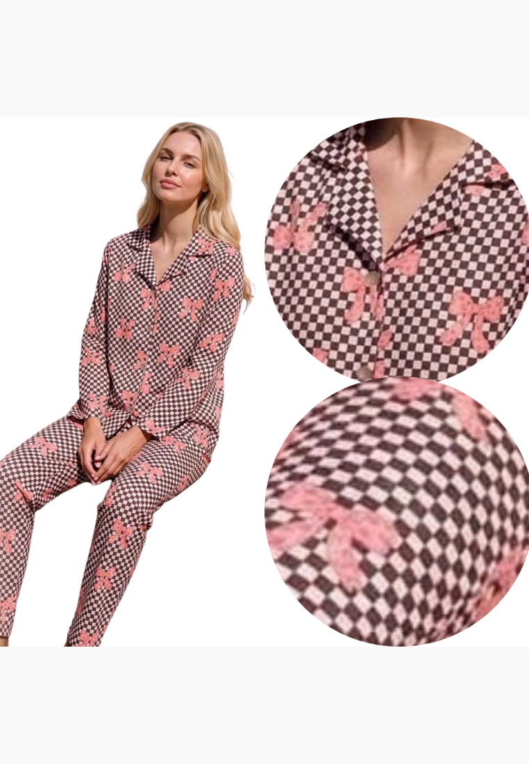 Lifestyle shot of a pink and brown floral pajama set with a button-up top.
