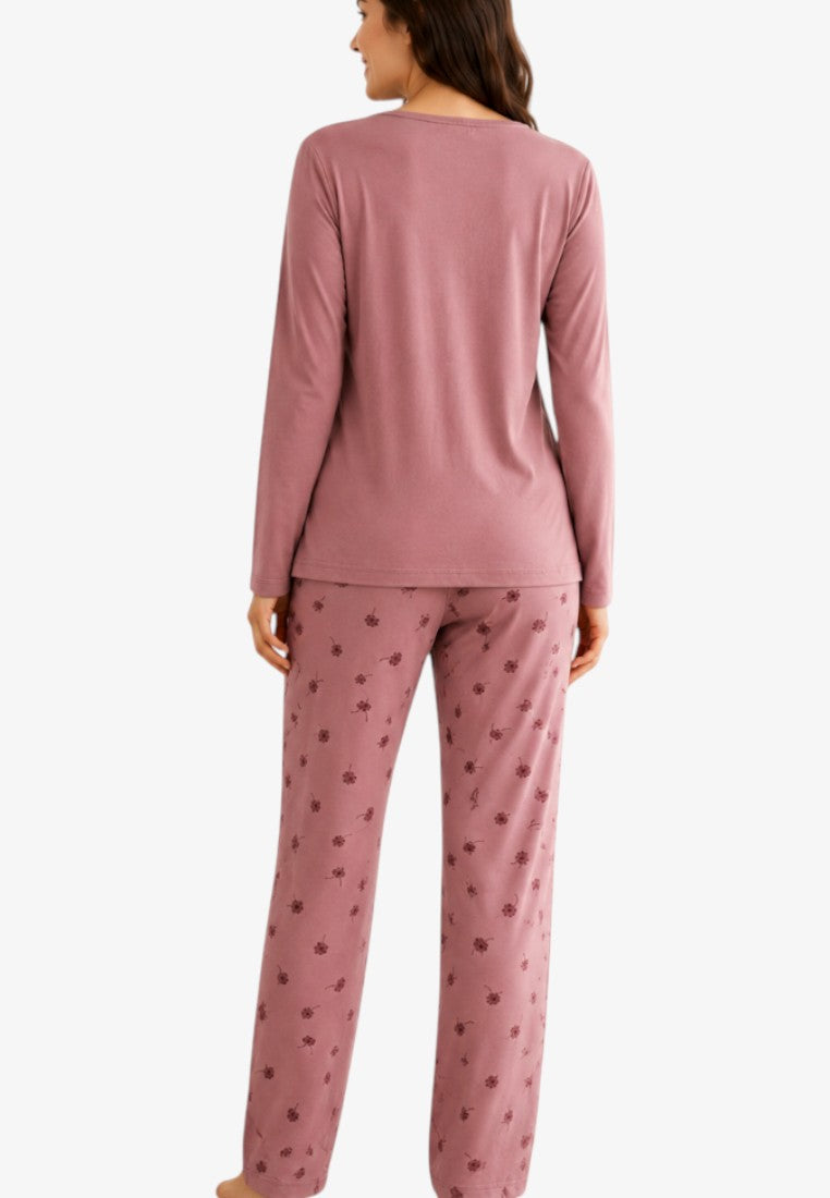 Back view of women's dusty pink pajama set with long sleeves and floral print trousers.