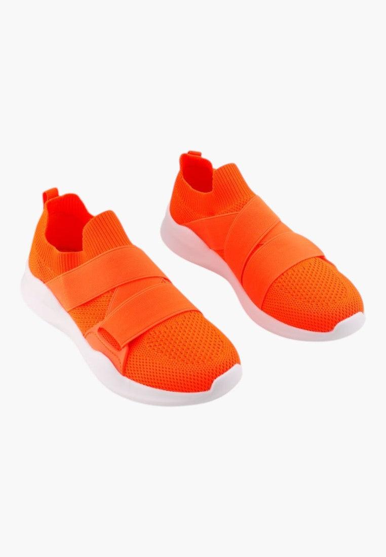 Front view of orange athletic shoes with slip-on design and mesh upper.