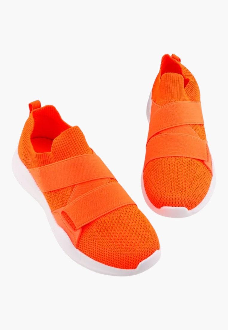 Front view of orange athletic shoes featuring a slip-on design and mesh upper.