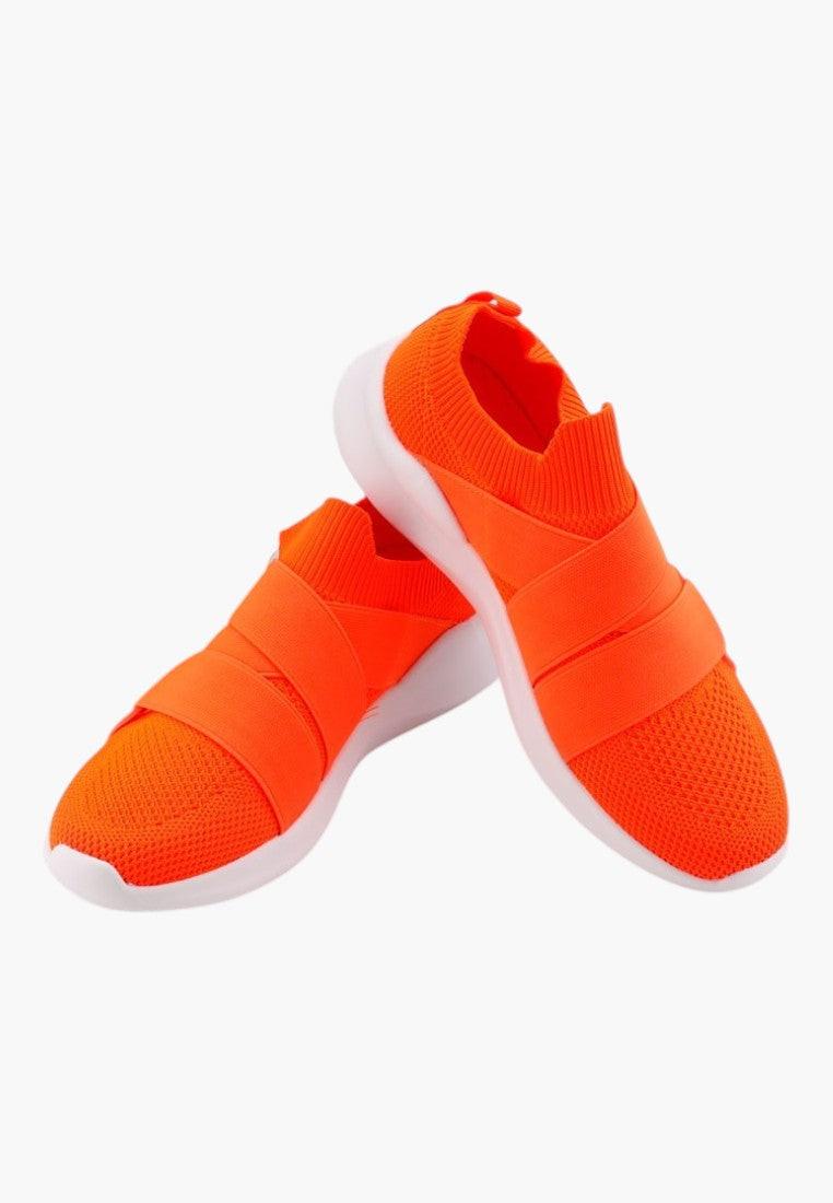 Side view of orange athletic shoes with slip-on design and mesh upper.