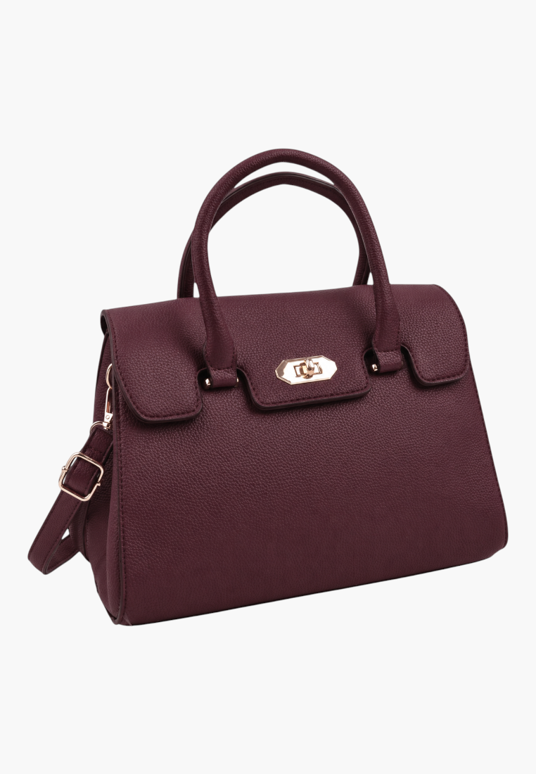 Front view of a burgundy handbag with top handles and gold hardware on a white background.