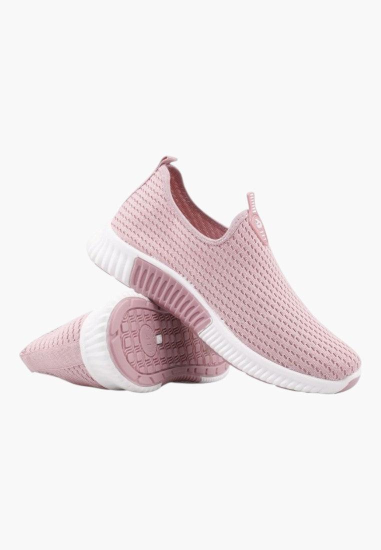 Różowe buty sportowe damskie z boku, pokazujące grubą podeszwę.