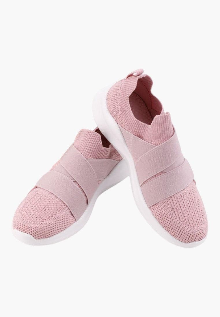 Różowe buty sportowe damskie, widok z boku, wsuwany design.