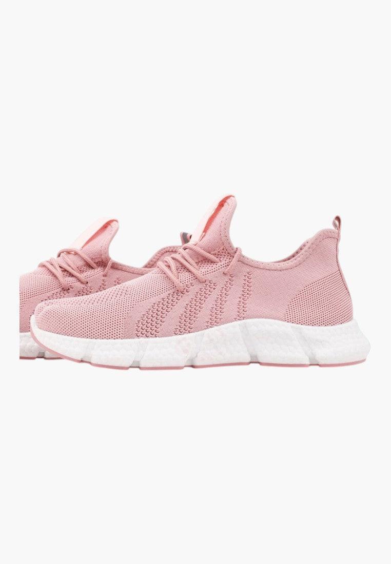 Różowe buty sportowe z elastyczną cholewką, widok z boku, lekki design