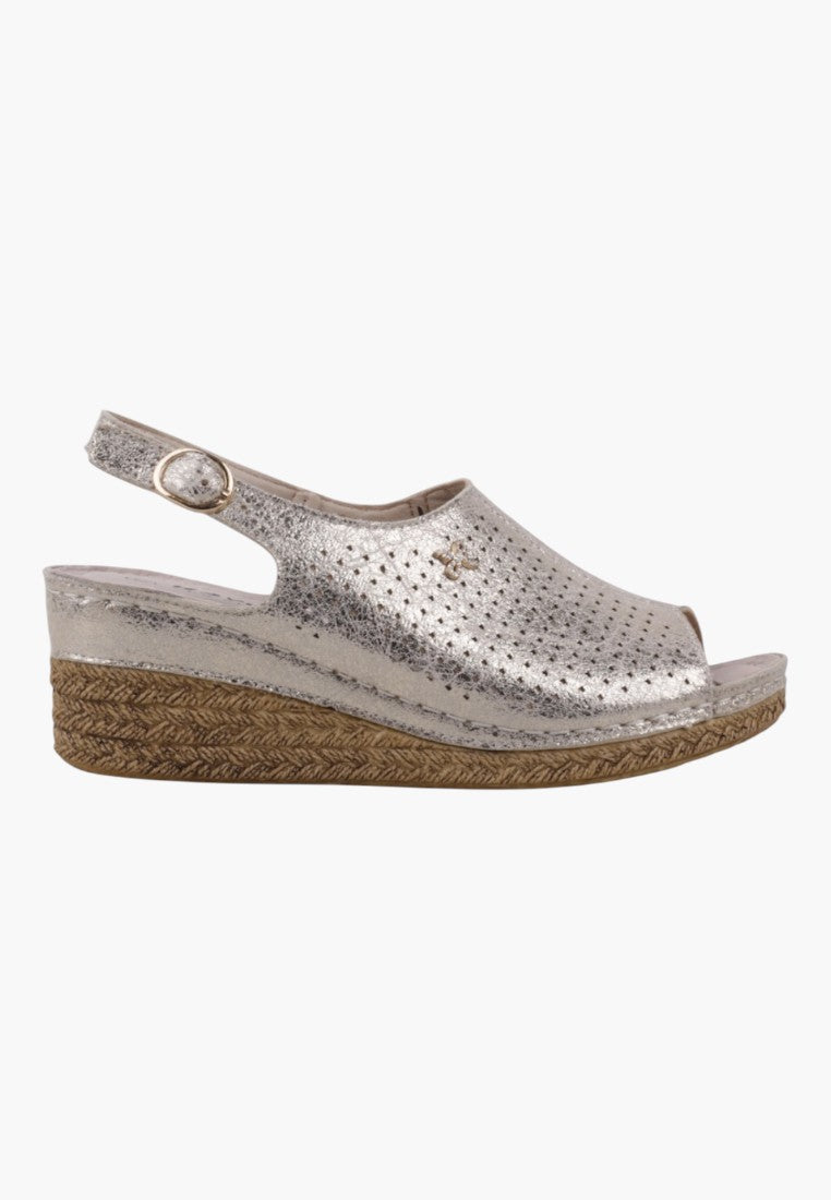 Side view of wedge sandals in silver and beige highlighting wedge heel and slingback design.