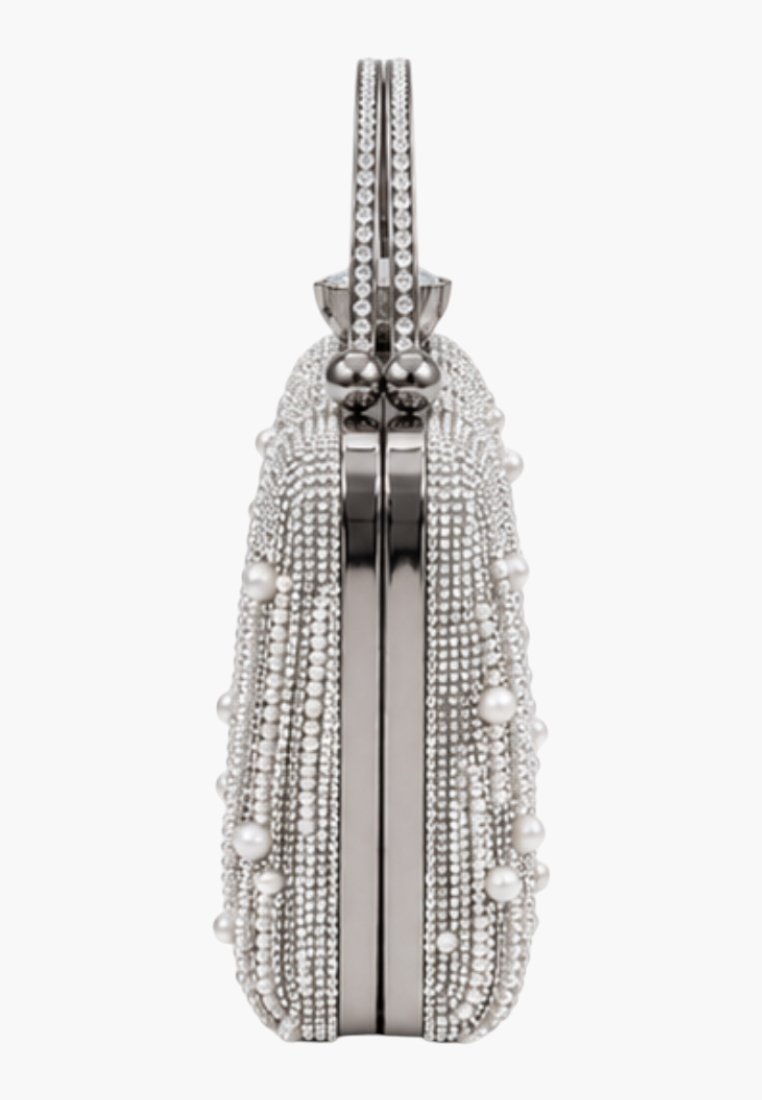 Close-up detail of the silver beaded clutch bag highlighting the beaded design.