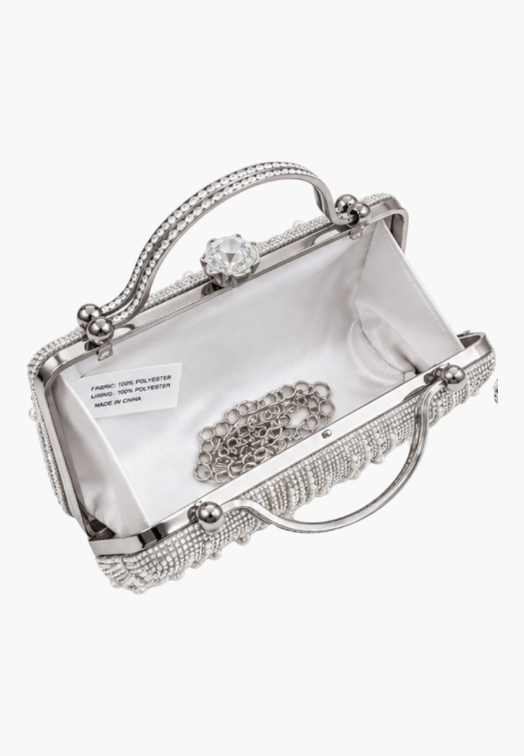 Interior view of the white-lined clutch bag featuring a smooth compartment.