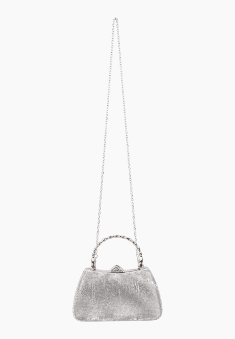 Detail close-up of the silver handbag showcasing the beaded handle and clasp closure.