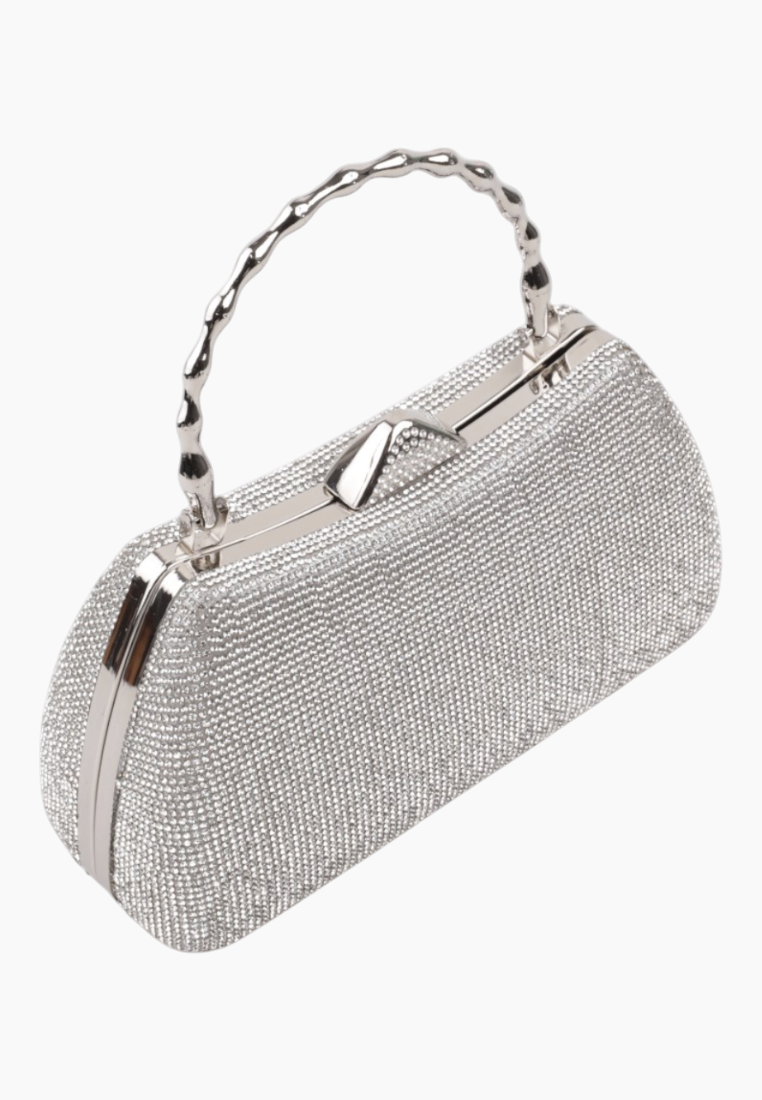 Side view of the silver handbag featuring a beaded handle and zipper closure.