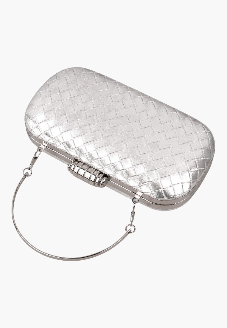 Other angle of a silver clutch bag highlighting its compact design and metal handle