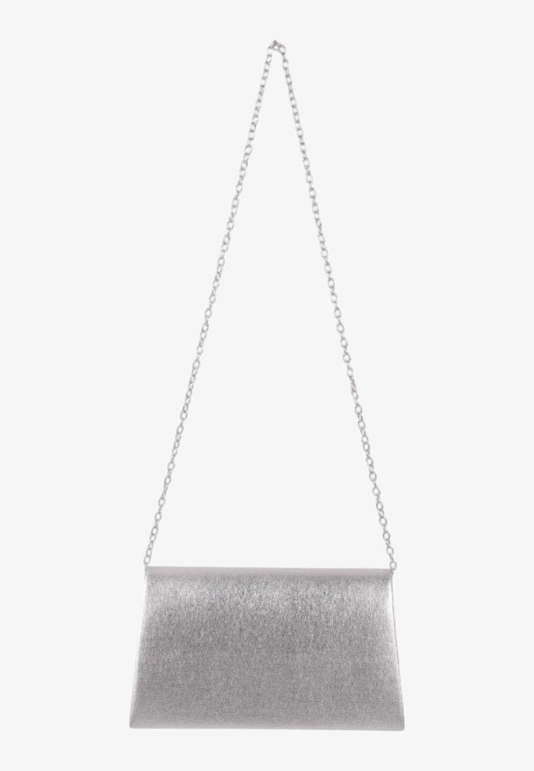 Side view of a silver clutch bag with a long strap and sleek design.